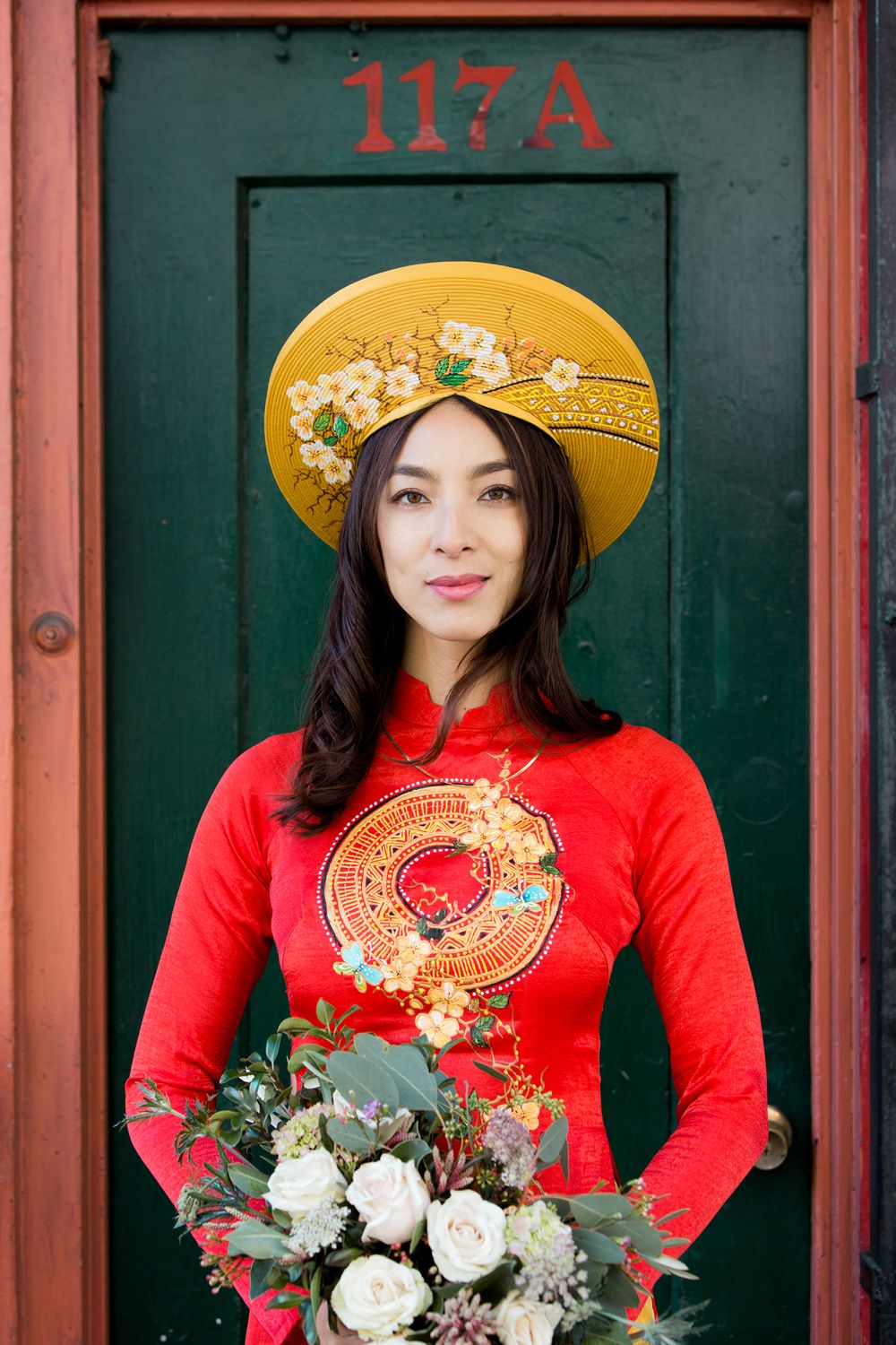 bride standing in front of a door in China town, San Francisco