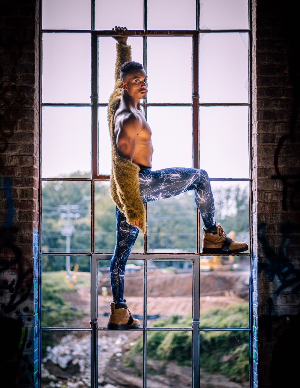 Strongshot Studio, Martinez, GA, Creative Photography, portrait of man clinging on a window frame.