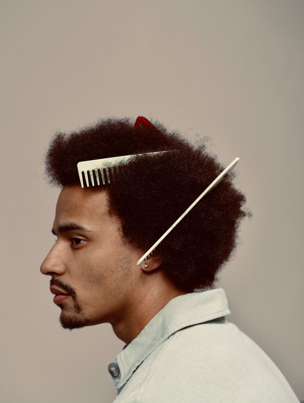 Strongshot Studio, Martinez, GA, Creative Photography, side portrait of man with many combs in his hair.