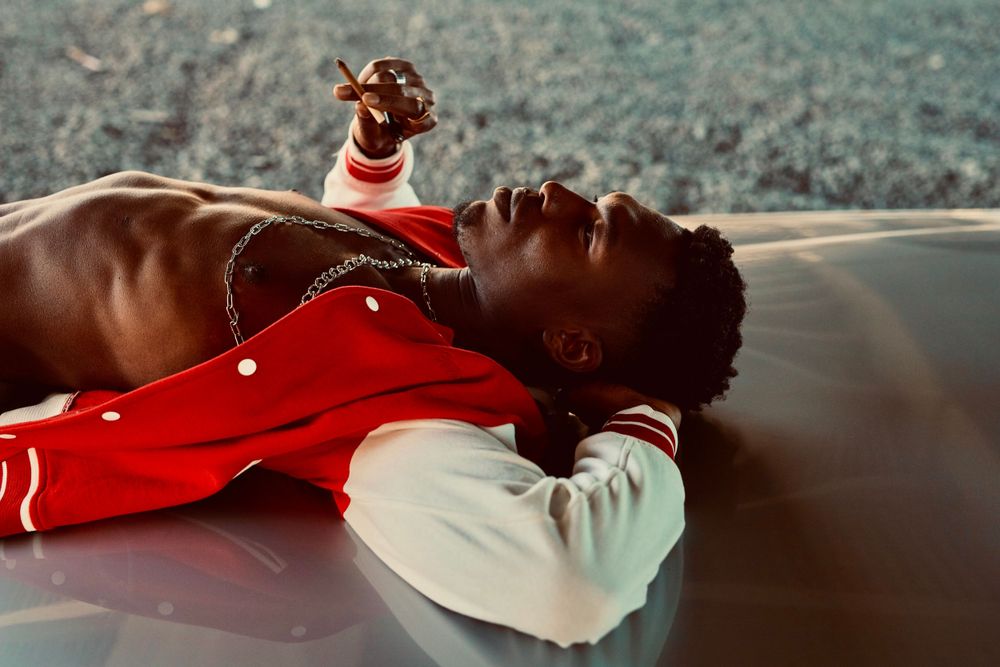 Strongshot Studio, Martinez, GA, Creative Photography, Portrait of urban man smoking and lying on his car.