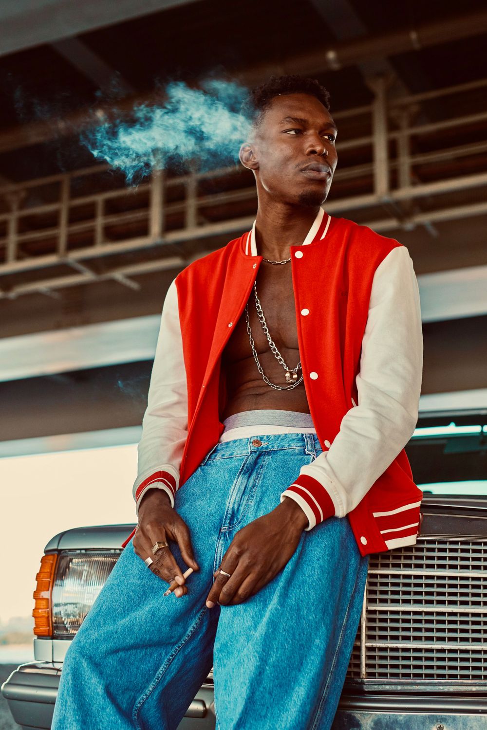 Strongshot Studio, Martinez, GA, Creative Photography, Portrait of urban man smoking while leaning on car.
