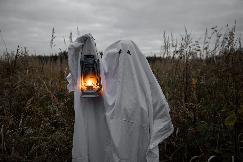 Strongshot Studio, Martinez, GA, Creative Photography, halloween ghost holding a lantern outdoors.