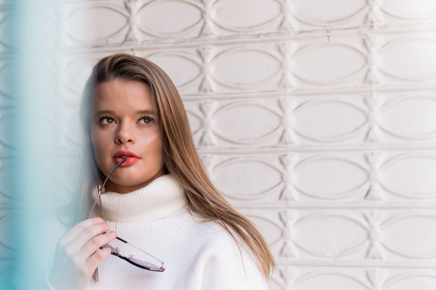 Woman near white wall in downtown Denver, Colorado