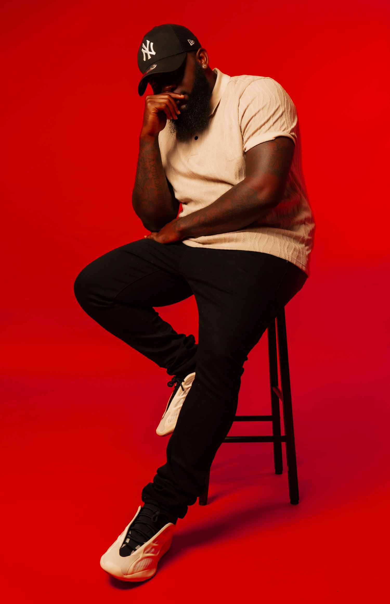 Individual posed in studio lighting
