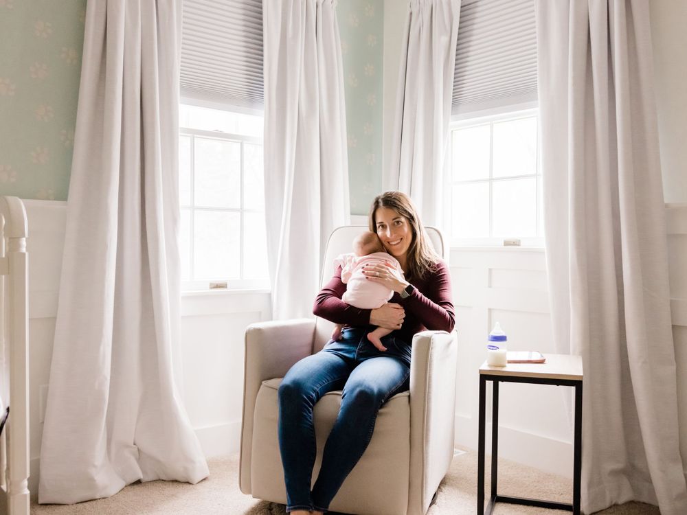 Infant lifestyle photography new mother and infant girl on white nursery chair