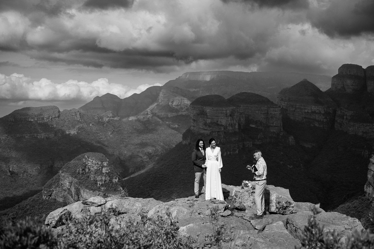 Couple holds wedding ceremony on a rock with a beautiful view, Blyde Canyon Forever Resort.