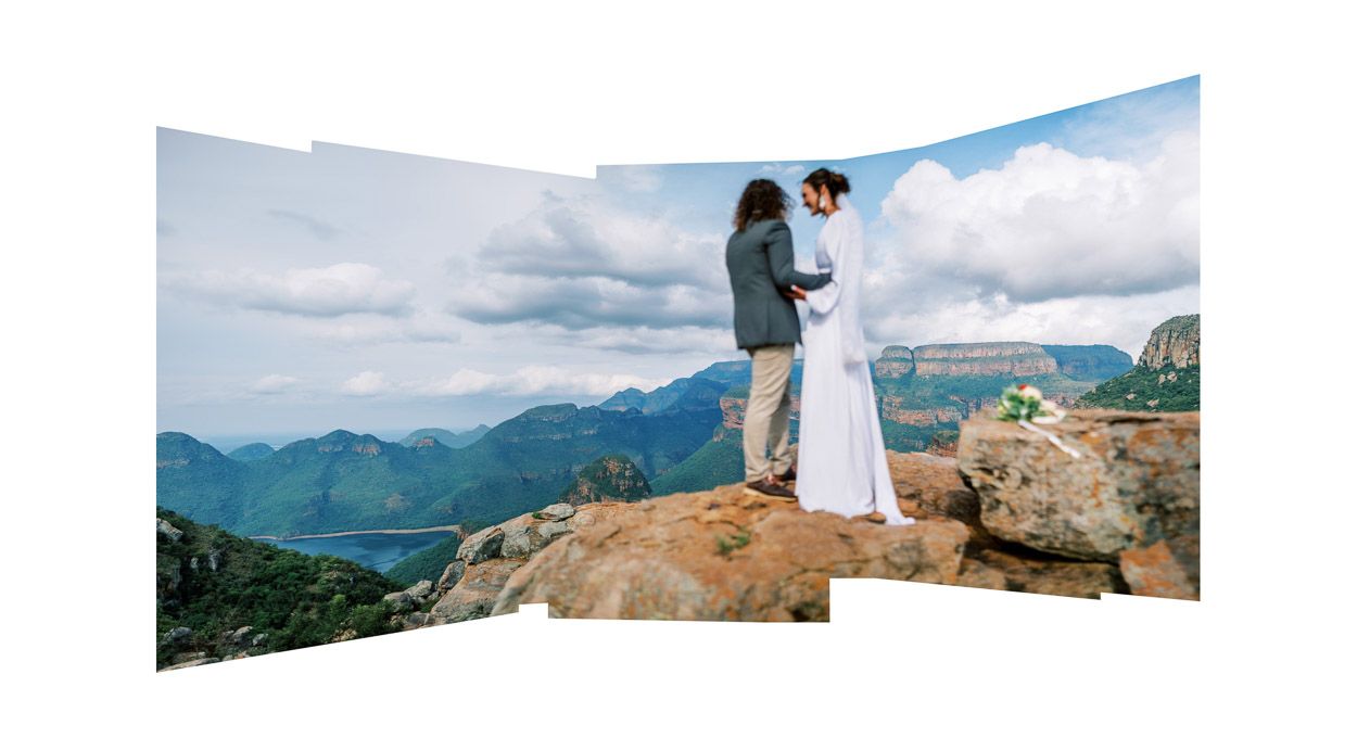 Couple stands on a rock with a beautiful view of the Blyde River Canyon, Blyde Canyon Forever Resort.