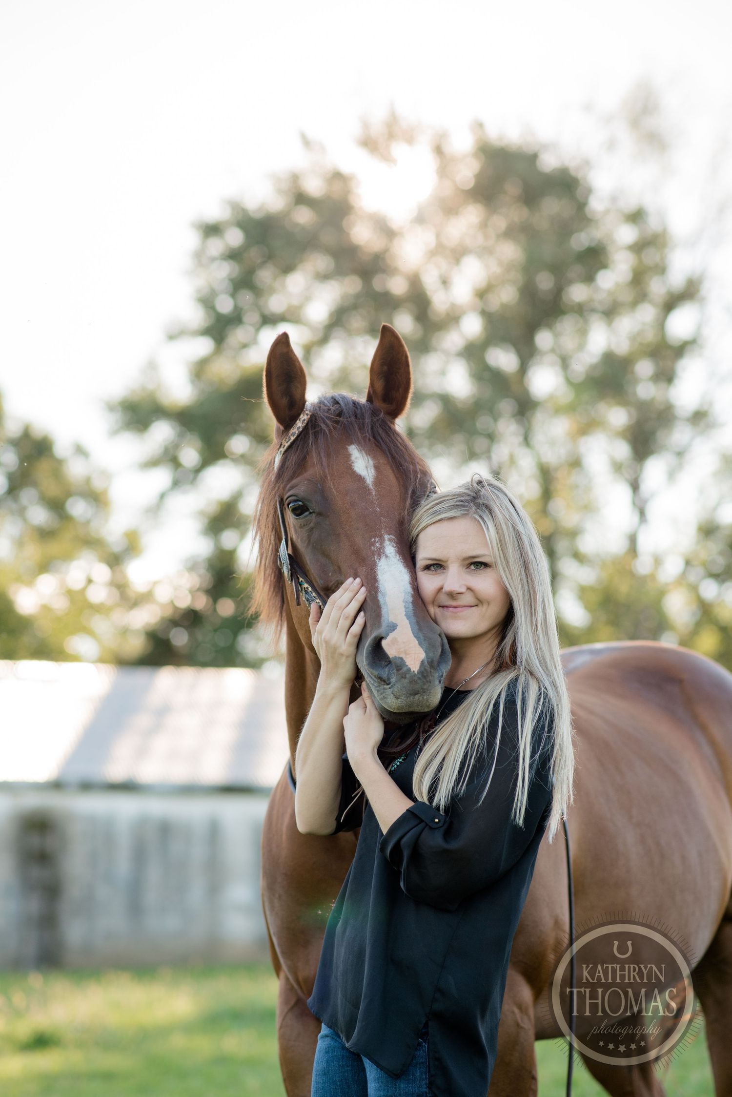 A touching portrait of companionship between a horse and its caretaker near a rustic barn.