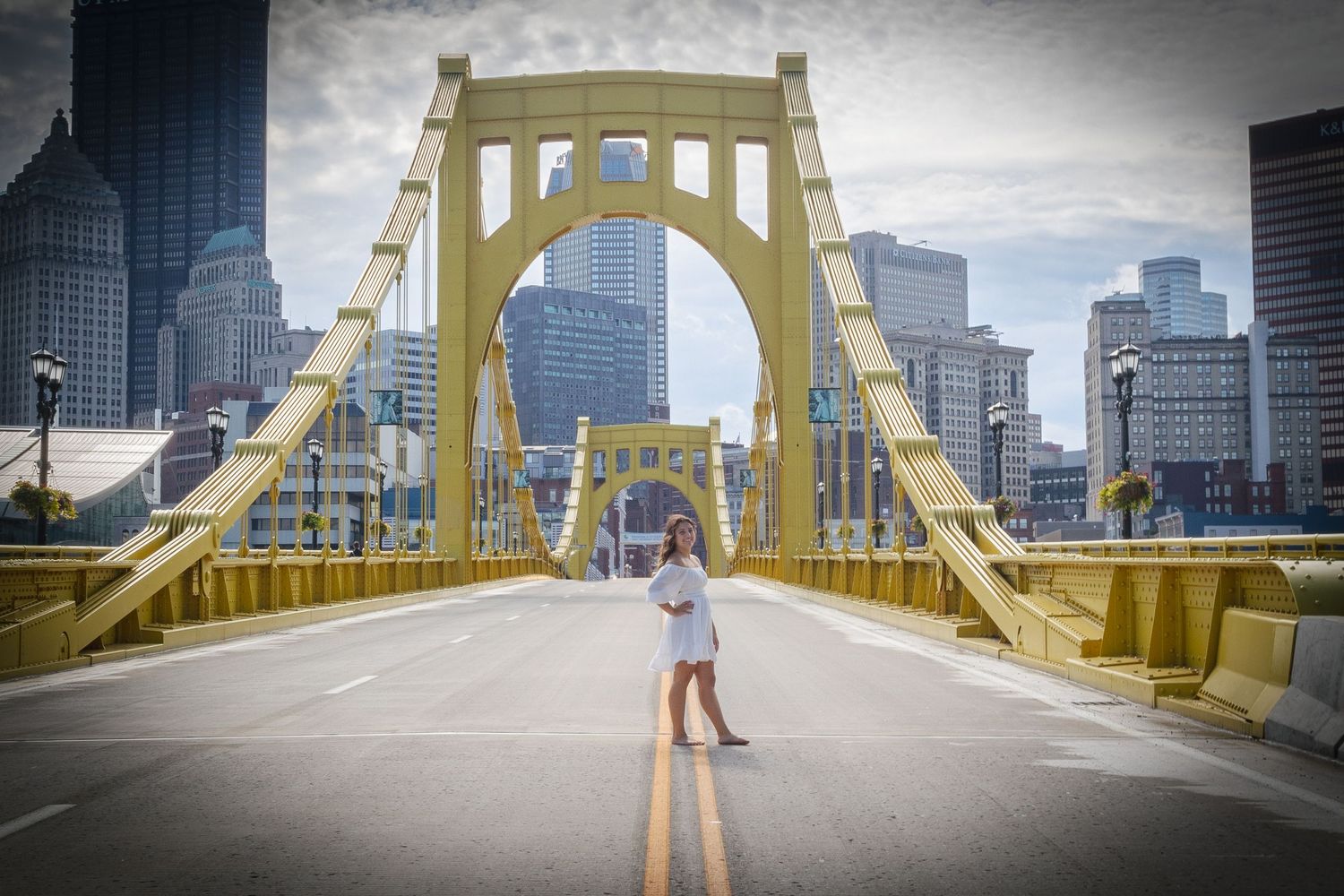 Wow, a perfectly posed senior portrait on a bright yellow bridge
