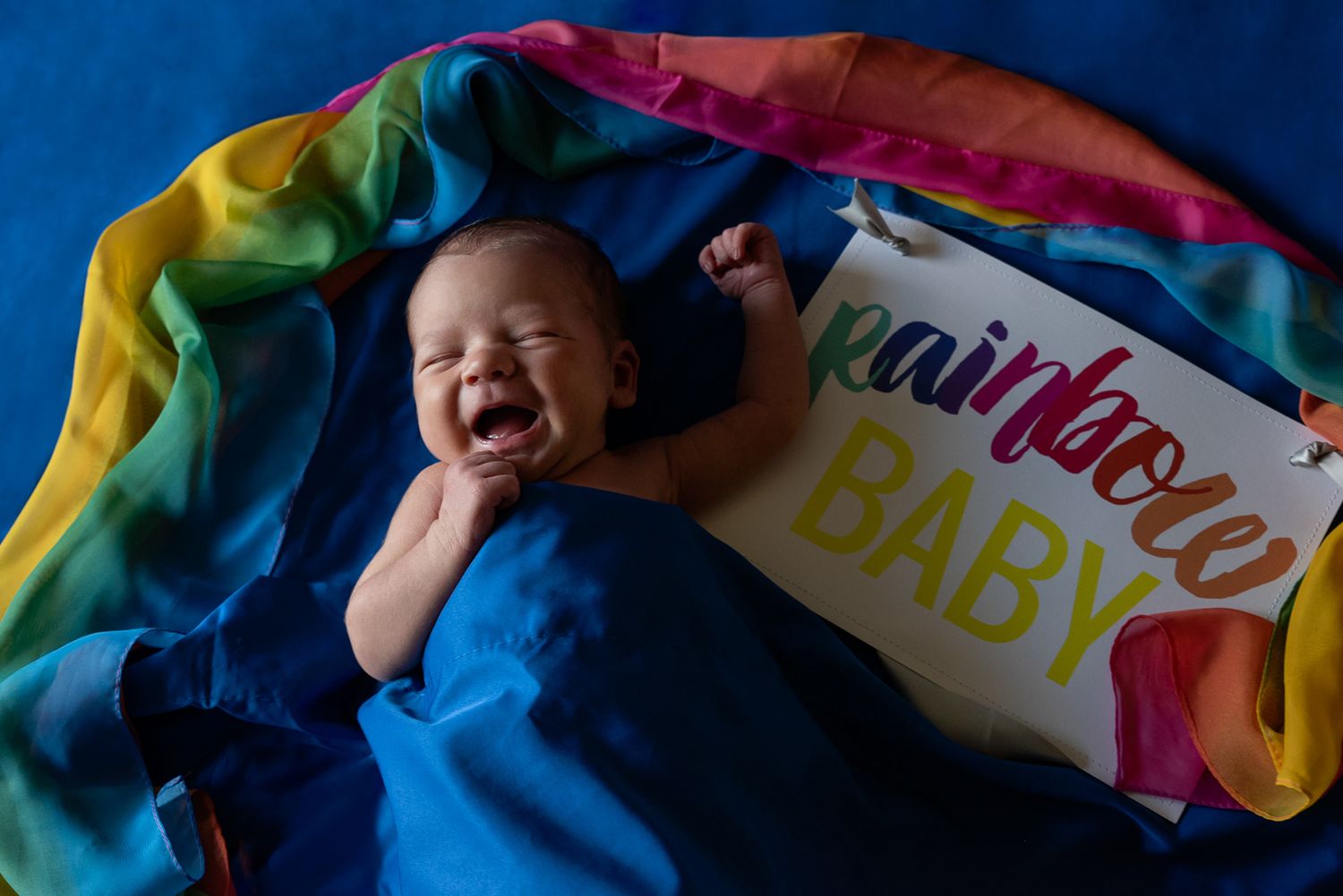 Rainbow baby newborn photography session. At home lifestyle newborn photo session. Dayton Ohio. Lindsey Stoebner Photo.