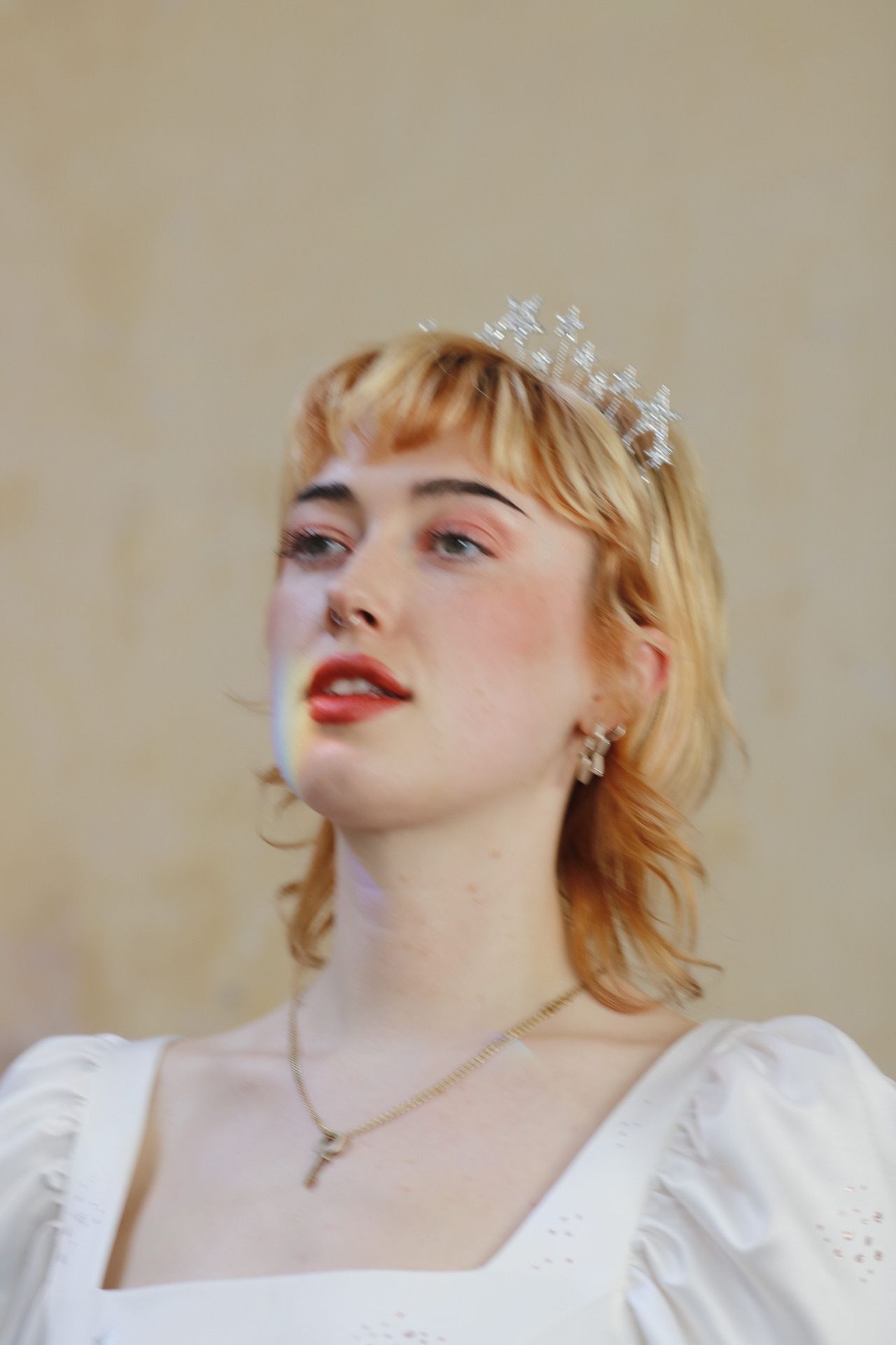 Bridal portrait showcasing crystal crown and classic vintage-inspired styling.