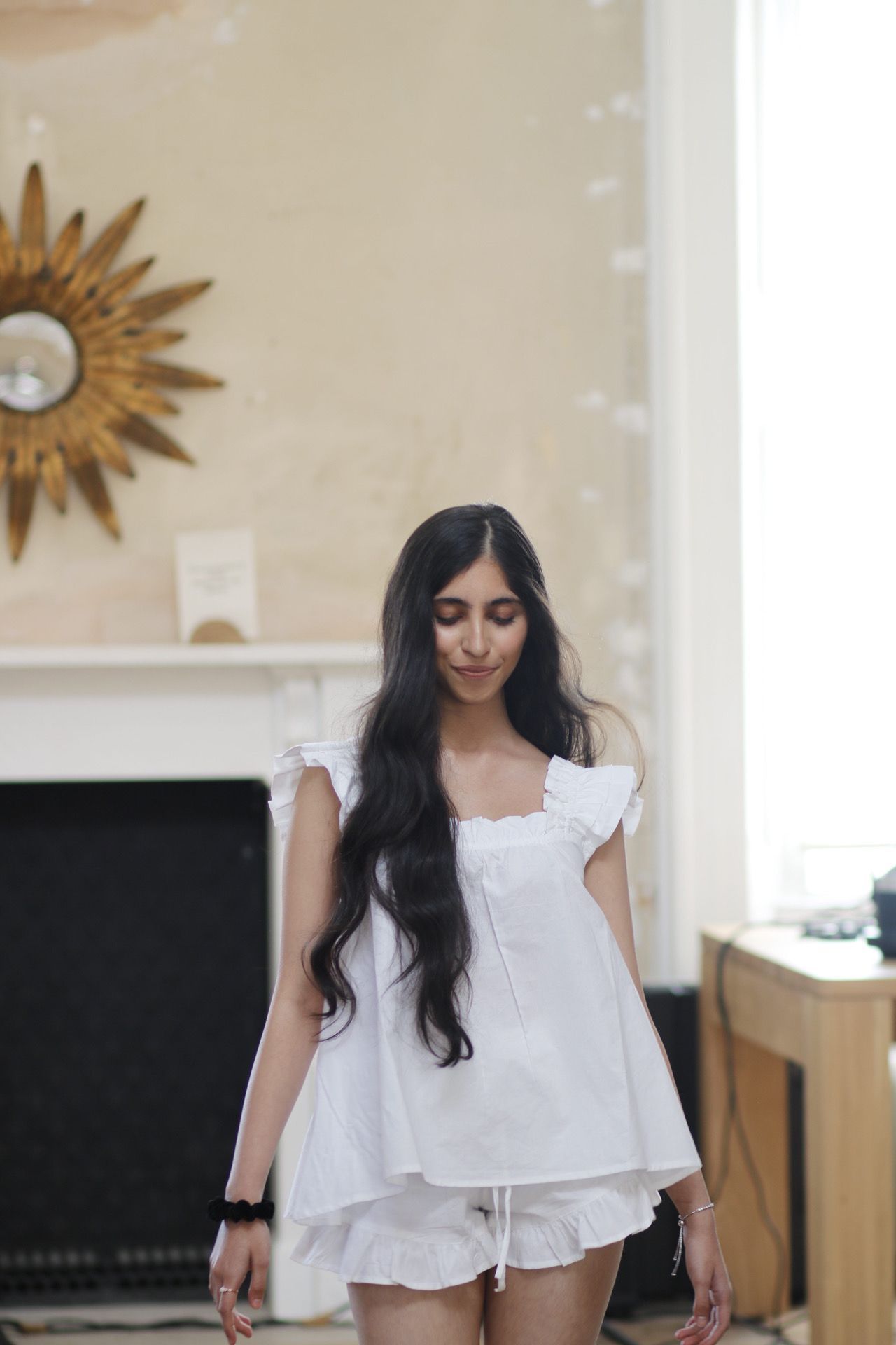 Casual white cotton loungewear set with flutter sleeves and shorts.