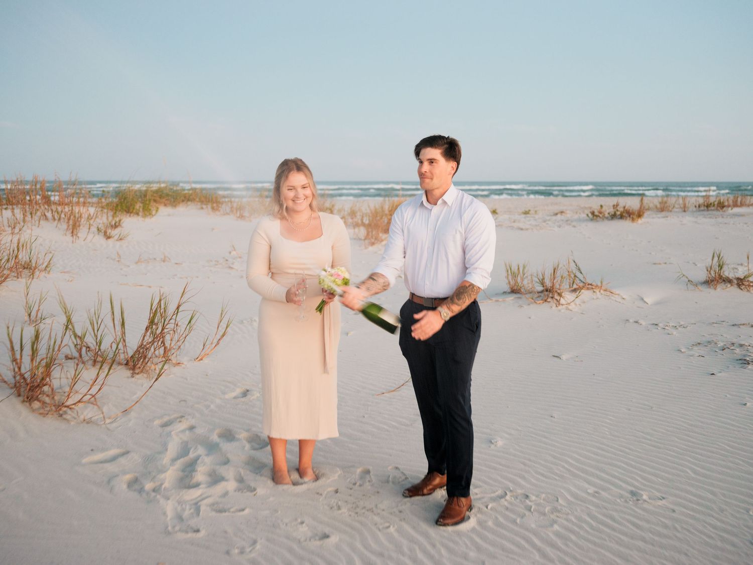 couples propose on the beach