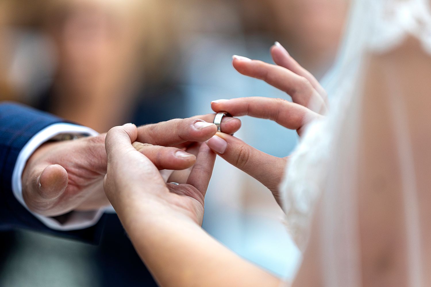 bride putting ring on groom the white hart Derbyshire wedding photography