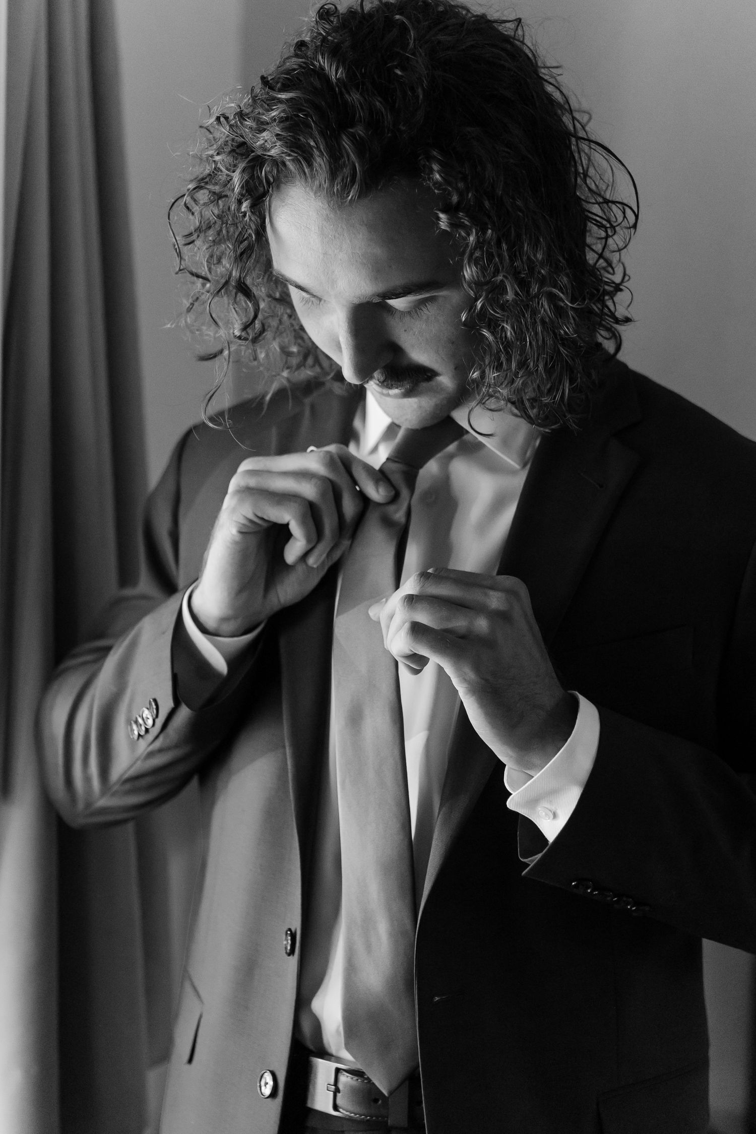 Groom getting ready Estes Park, Colorado wedding photographer