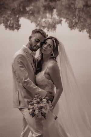 Romantic sepia wedding portraits showing tender moments between bride and groom.