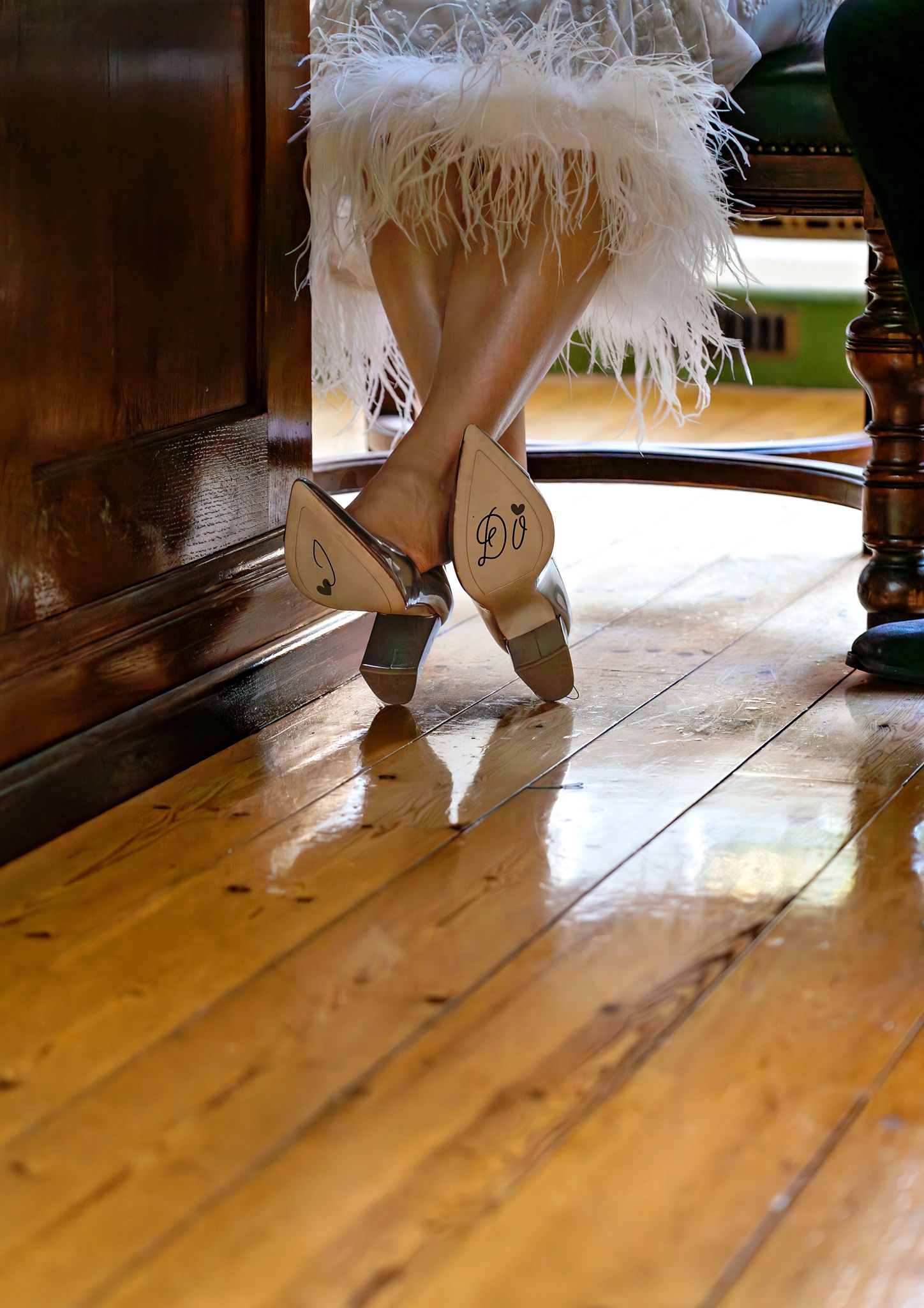 Bride's shoes with 'just married' on the sole of the shoes. Location: Bournemouth, Dorset.