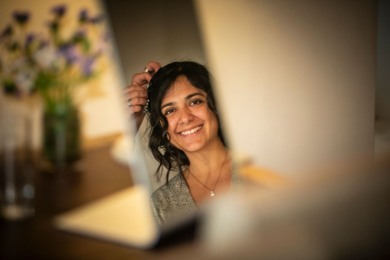 Soft focus portrait capturing a warm smile in natural window light.