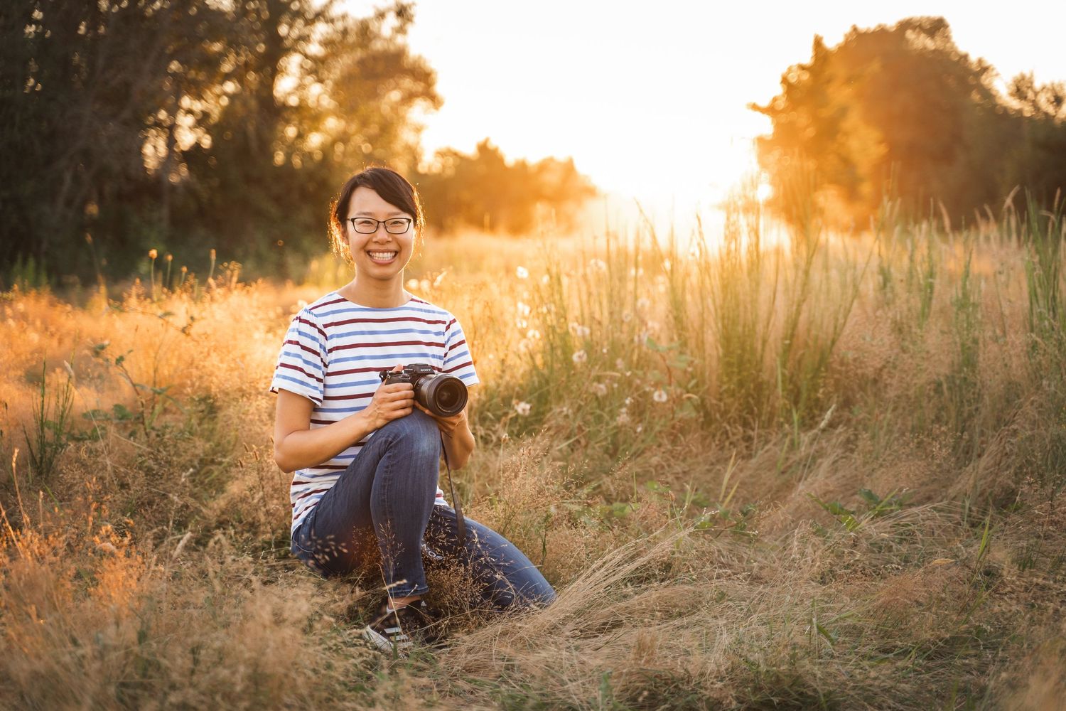family photographer at Marymoor park in redmond smiling with camera