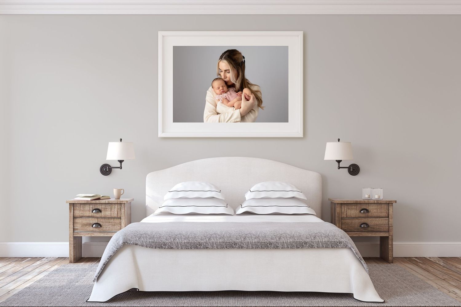 A newborn image in a frame on the wall of a bedroom