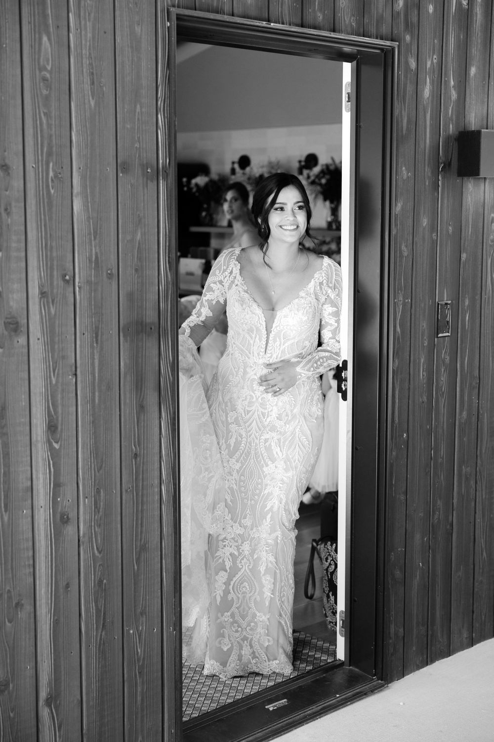 Bride approaches groom for first look on wedding day at Jorgensen Farms in Westerville, Ohio.