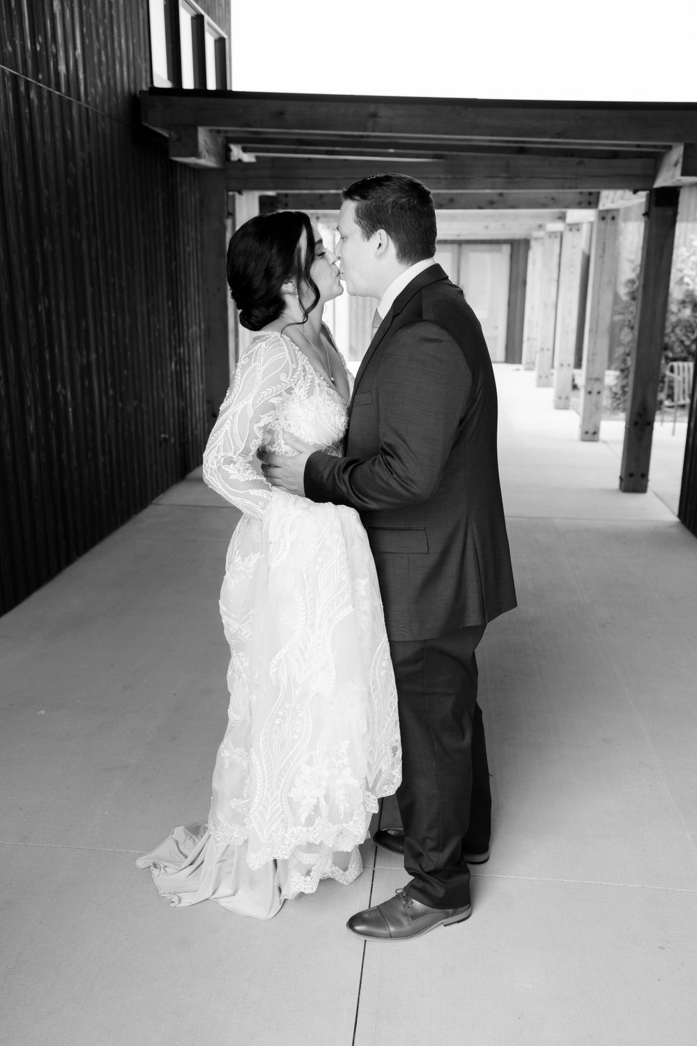 Bride and groom kiss on wedding day at Jorgensen Farms in Westerville, Ohio.