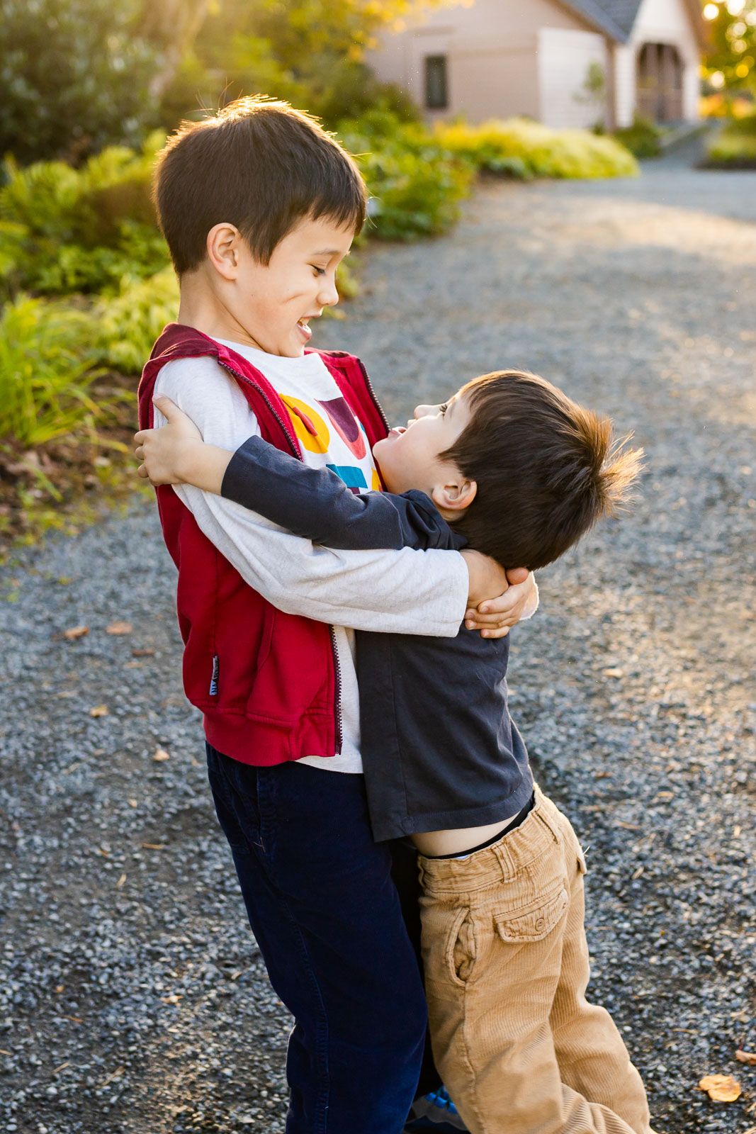 Tender moment of brothers hugging each other at Bellevue Botanical Garden