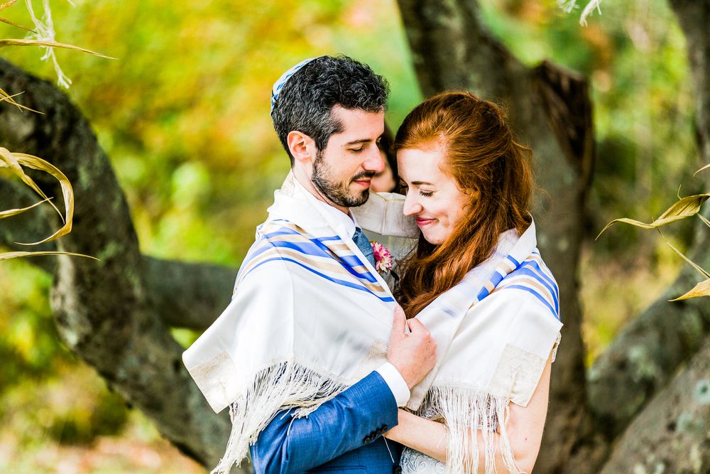 bride and groom during jewish wedding ceremony
