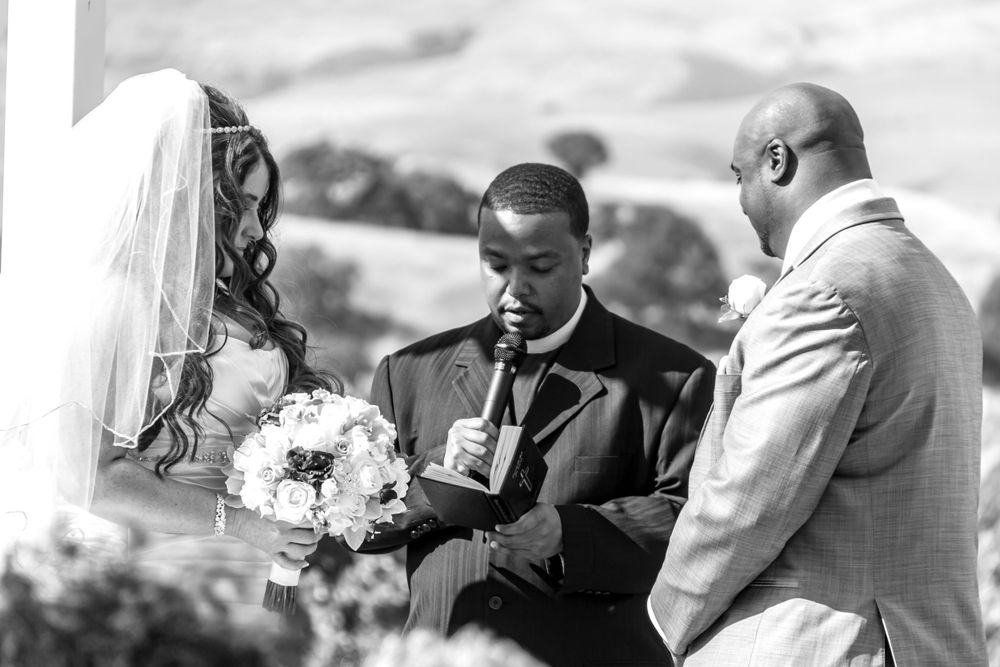 A collection of black and white wedding photos showing tender moments between couples during their celebrations.