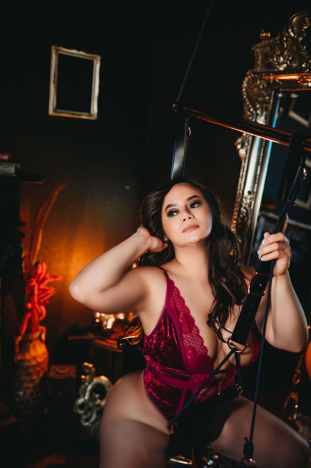 Confident woman posing gracefully in a luxurious boudoir studio in Indiana