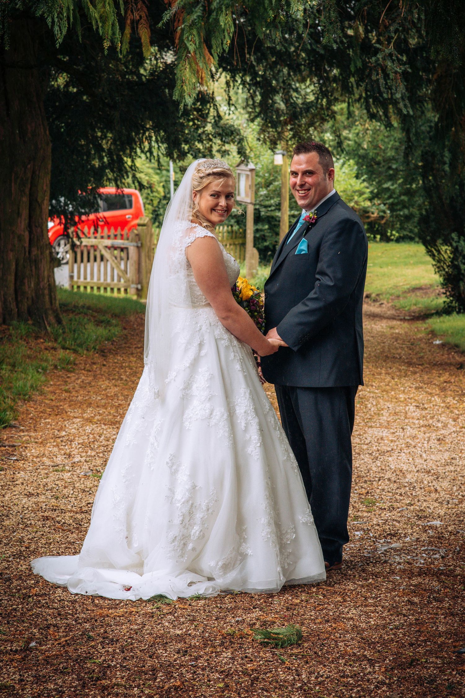 Bride and Groom in Elmore churchyard just married by Zara Davis Wedding Photographer Gloucester cheltenham stroud