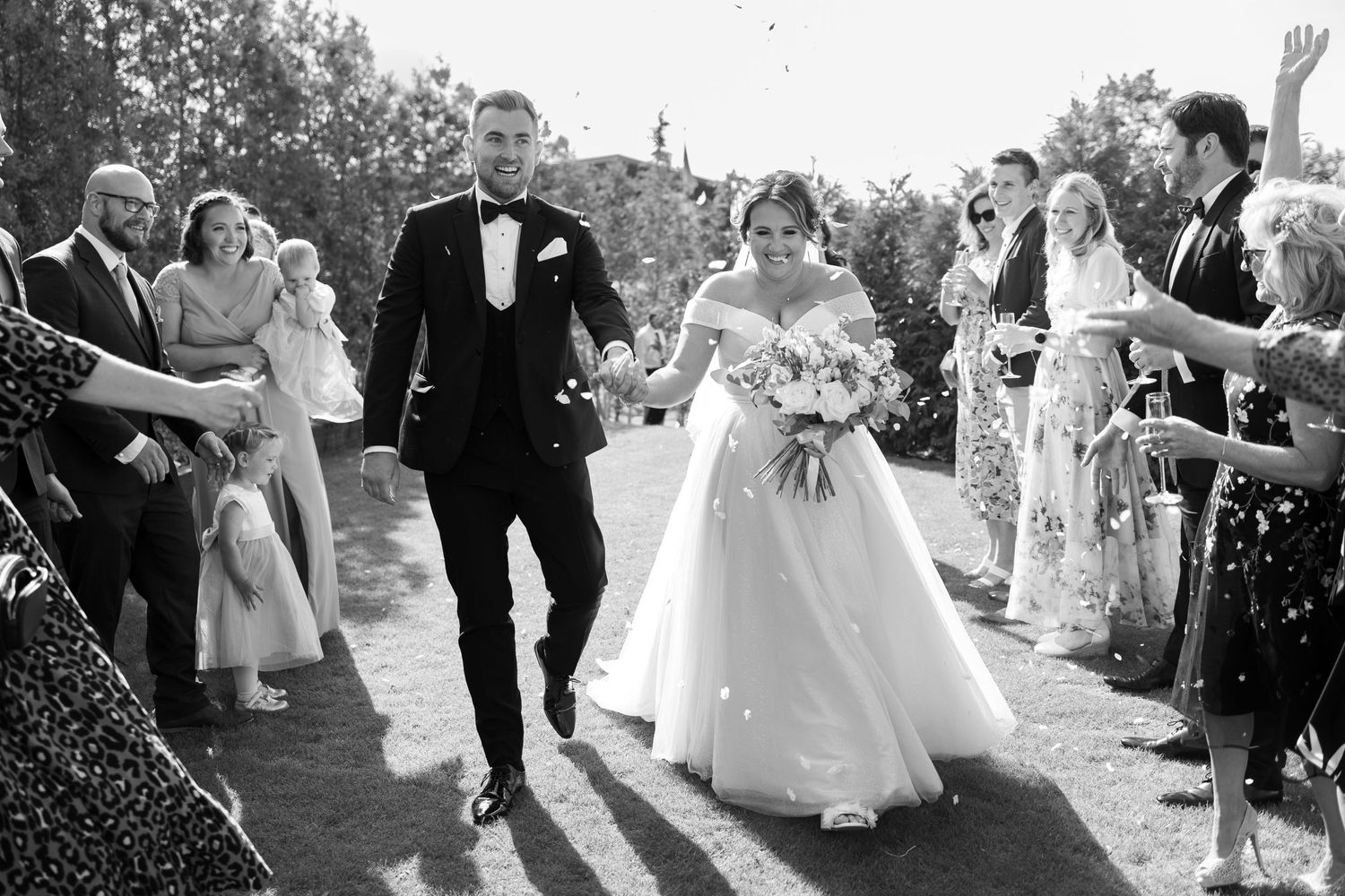 Bride and groom confetti throw wedding day
