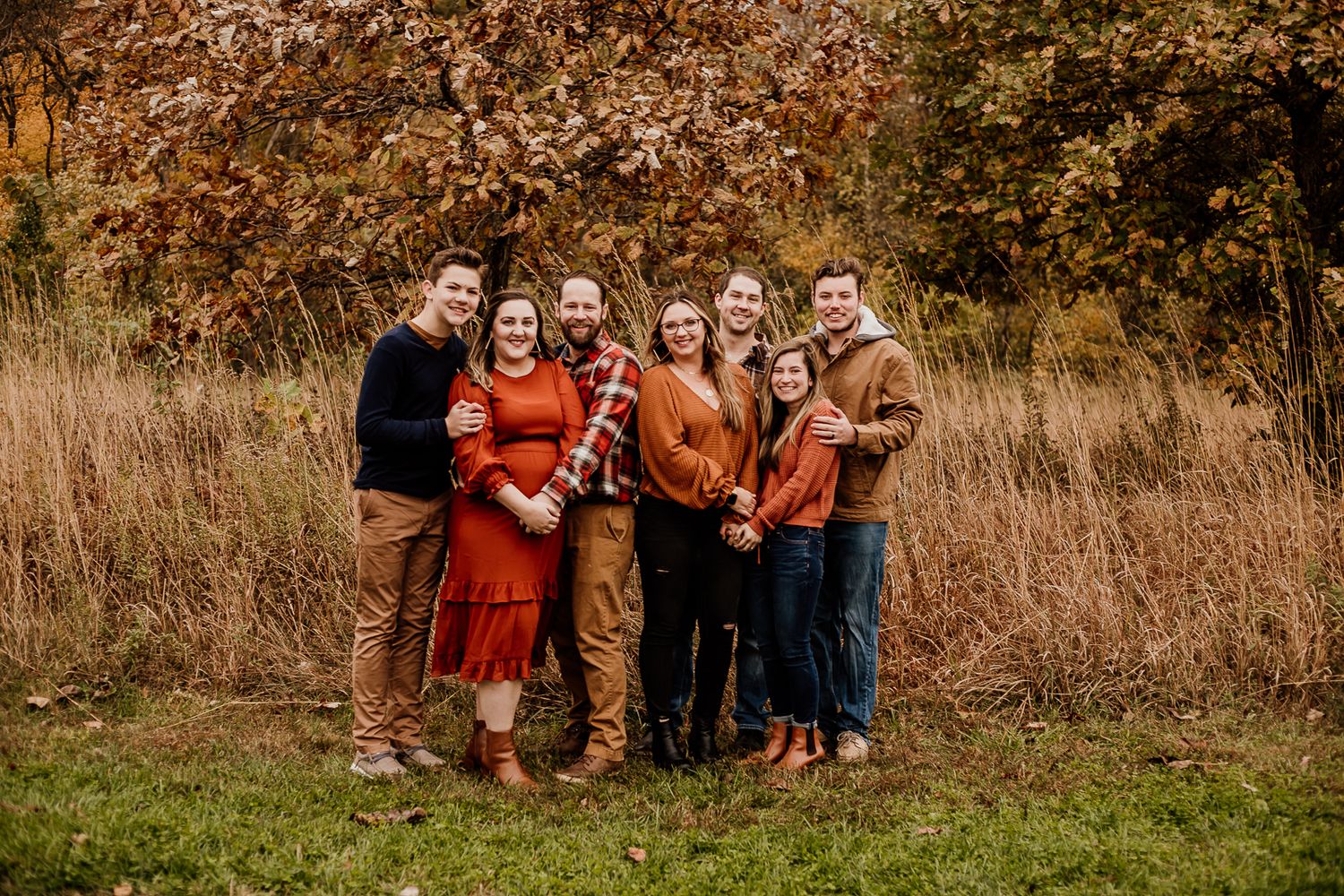 Multiple candid family group shots in natural outdoor fall setting.