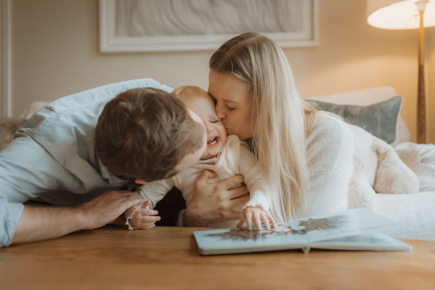 An intimate moment of sharing a book together on a wooden surface with soft lighting.