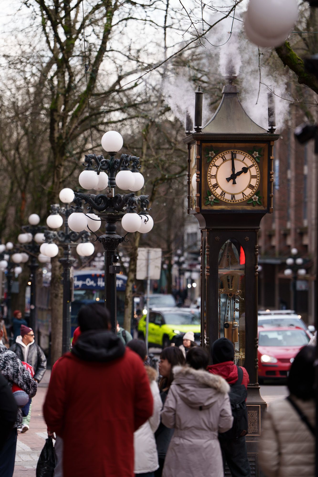 People gathered around Gastown Steam Clock in Vancouver, British Columbia, Street Photography.