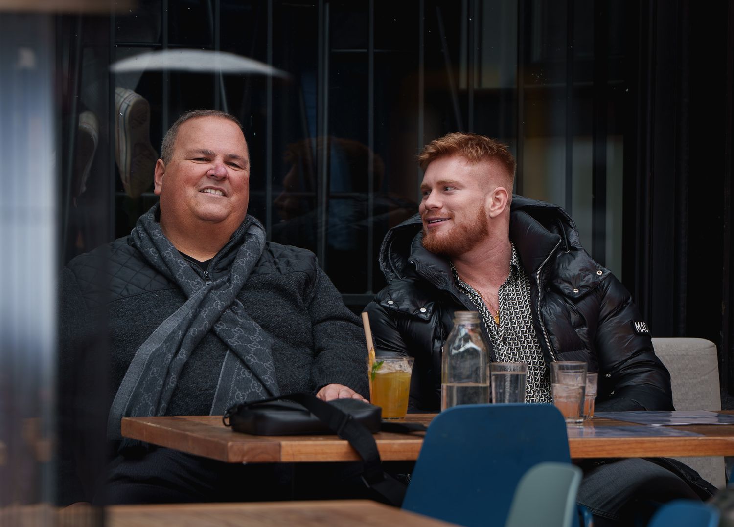 two men having conversation, street photography.
