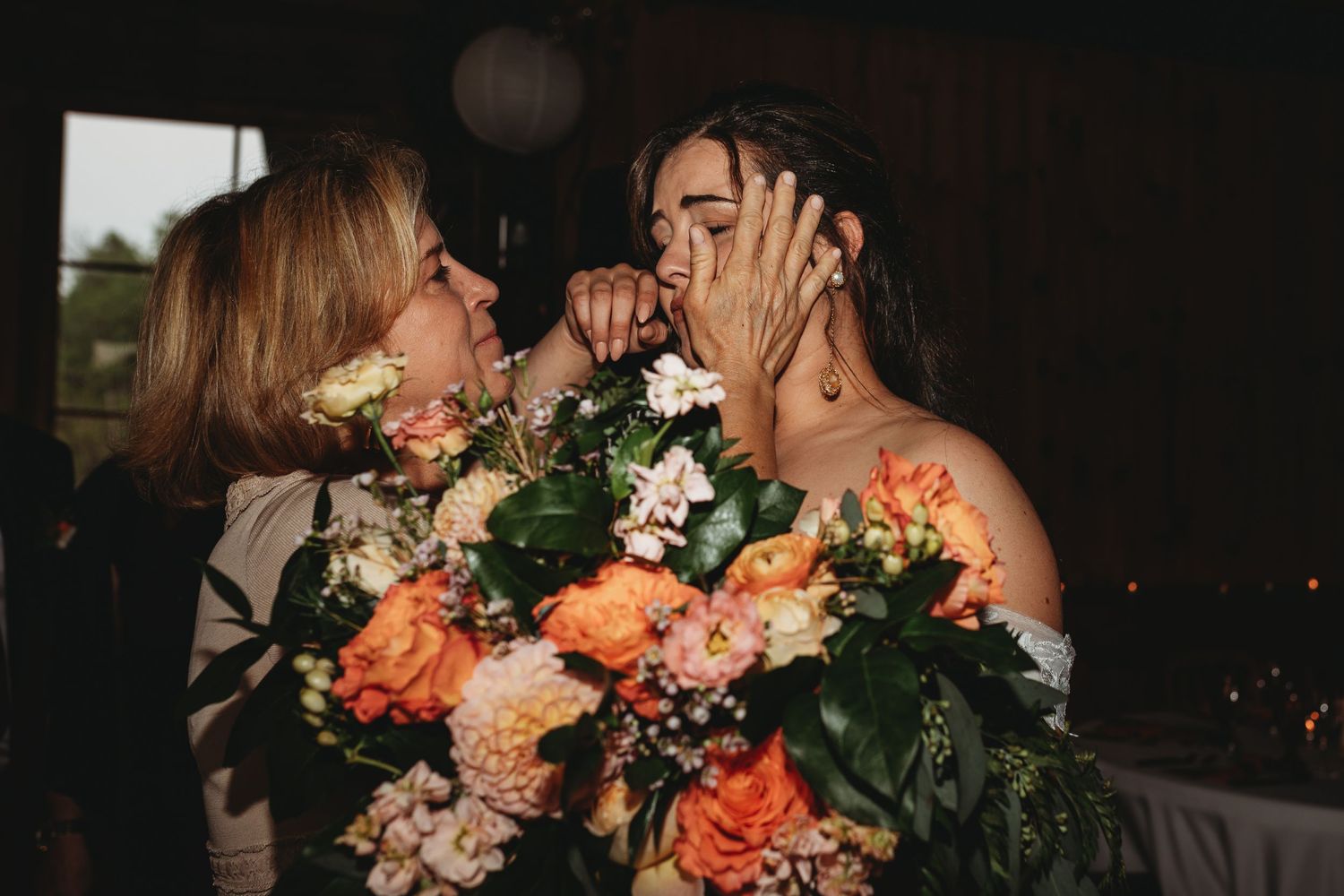 emotional moment between bride and mother after ceremony mont tremblant