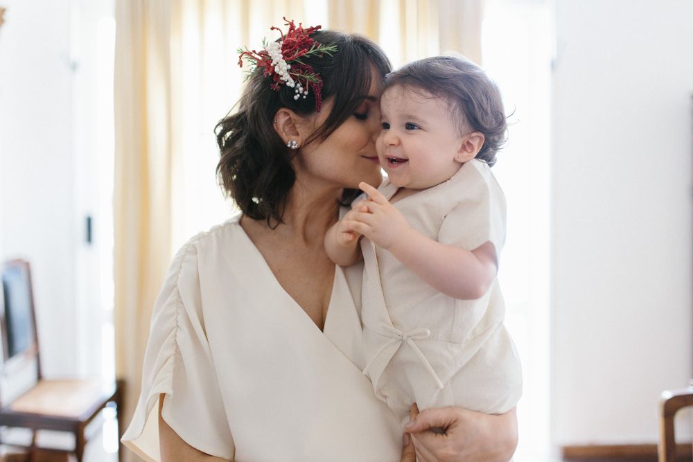 Intimate moment between parent and child during special occasion.