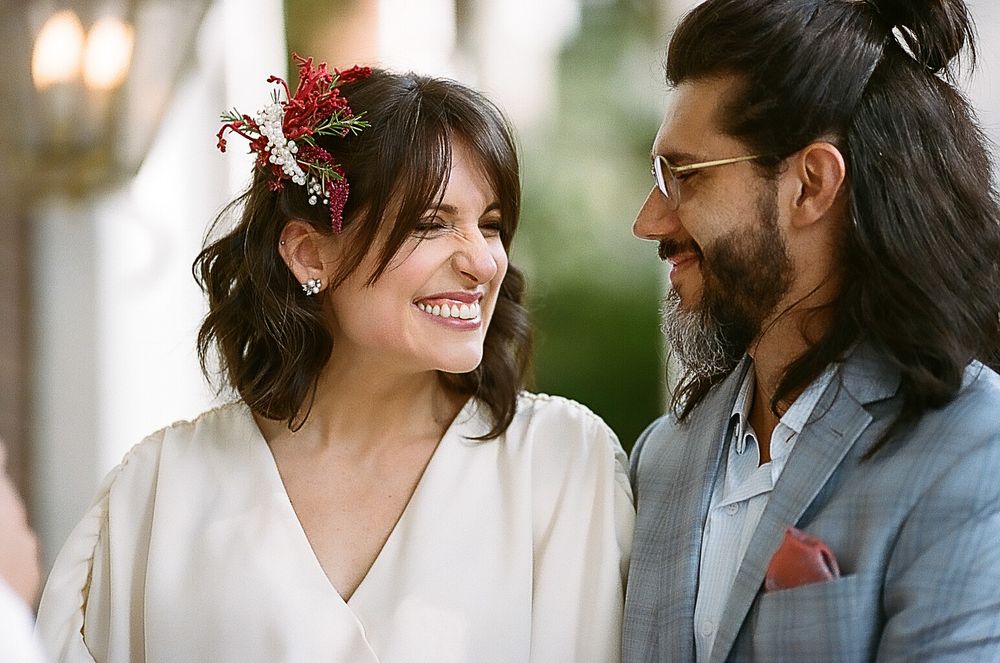 A romantic moment captured between a couple during their wedding day.
