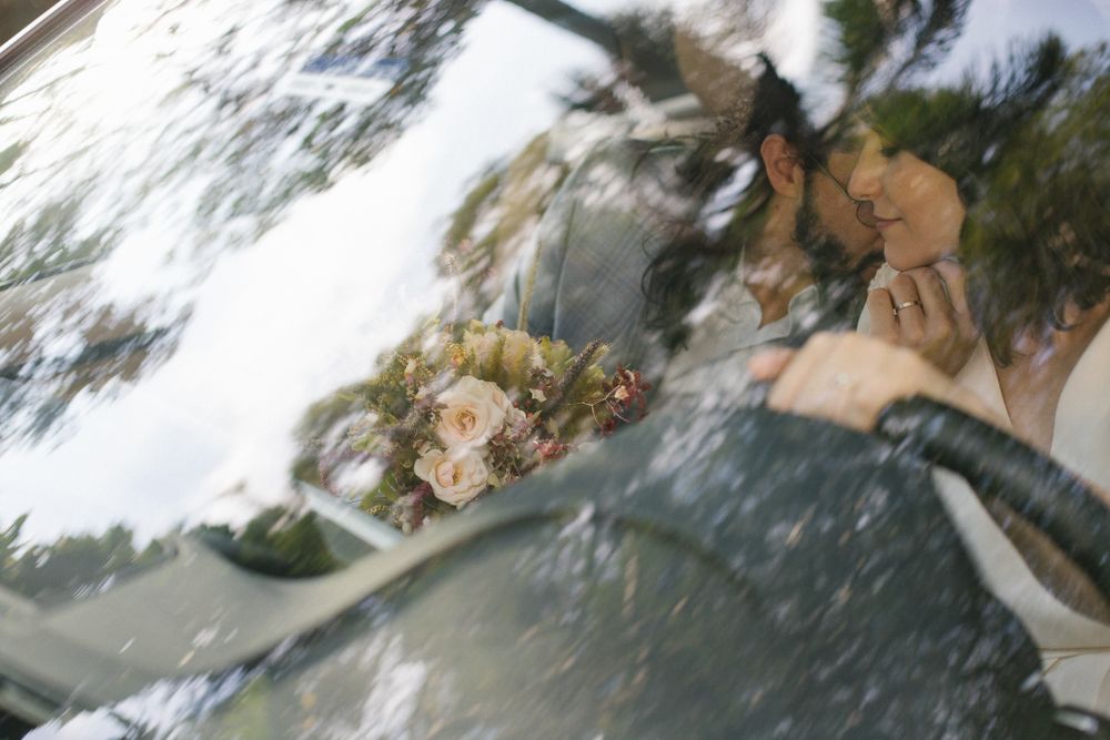 Abstract reflection in a car windshield showing blurred scenery.