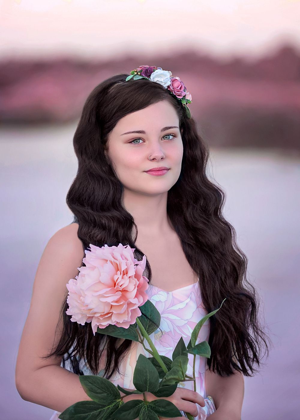 Girl in satin Couture gown holding an oversized flower at Rockingham Salt Lakes for Dream Dress Session.