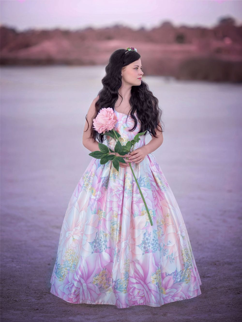 Girl in satin Couture gown holding an oversized flower at Rockingham Salt Lakes for Dream Dress Session.