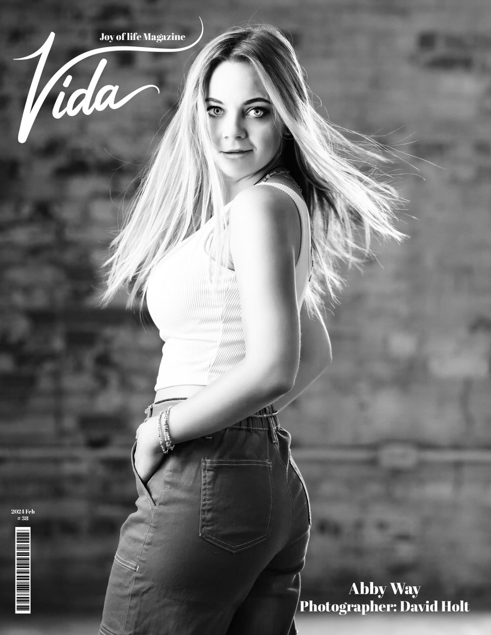 David G Holt Photography - Black and white magazine spread featuring dynamic poses against brick wall backdrop.