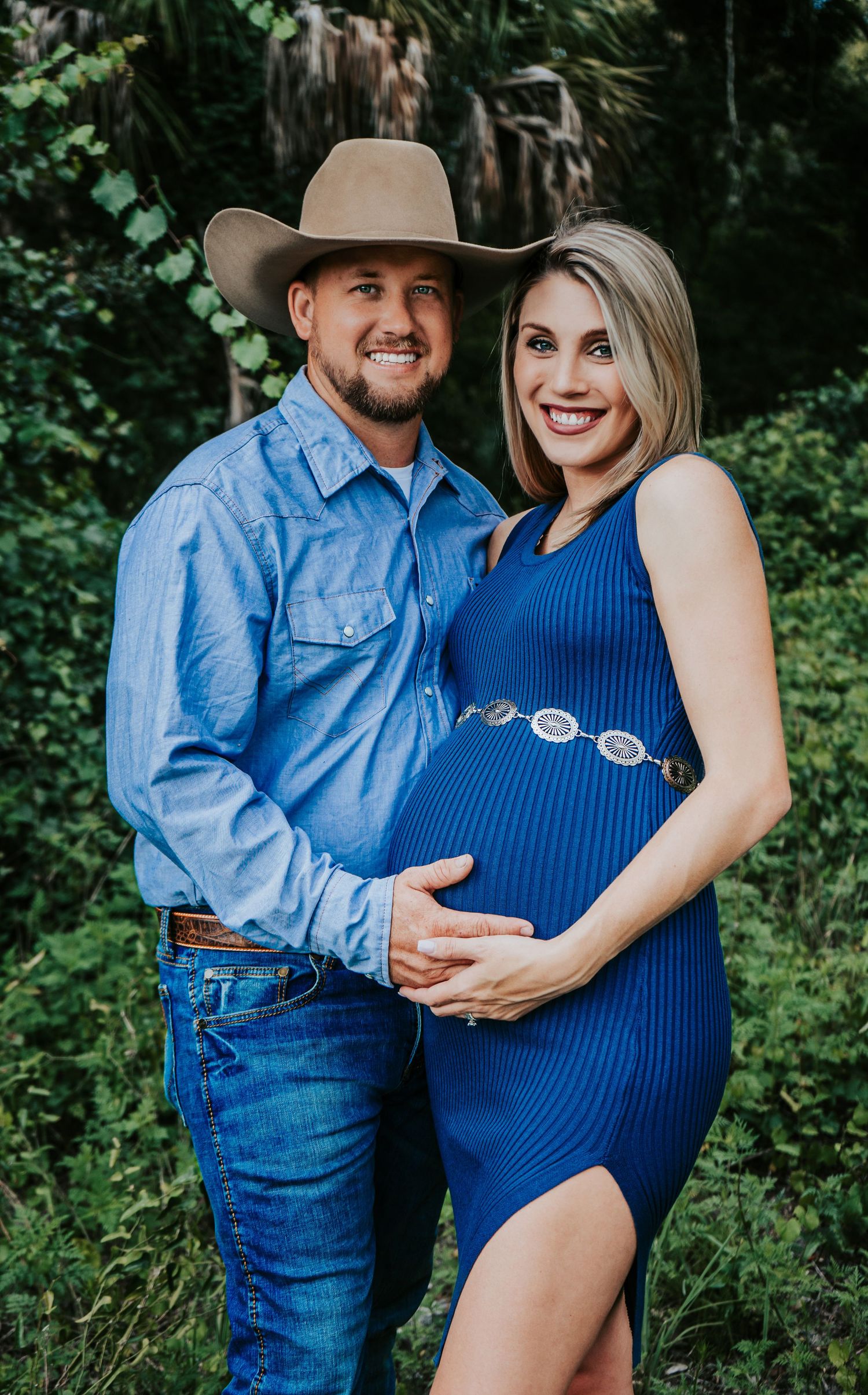 Outdoor Maternity Session at Thatcher Park, Lithia, FL; couple embracing in the forest