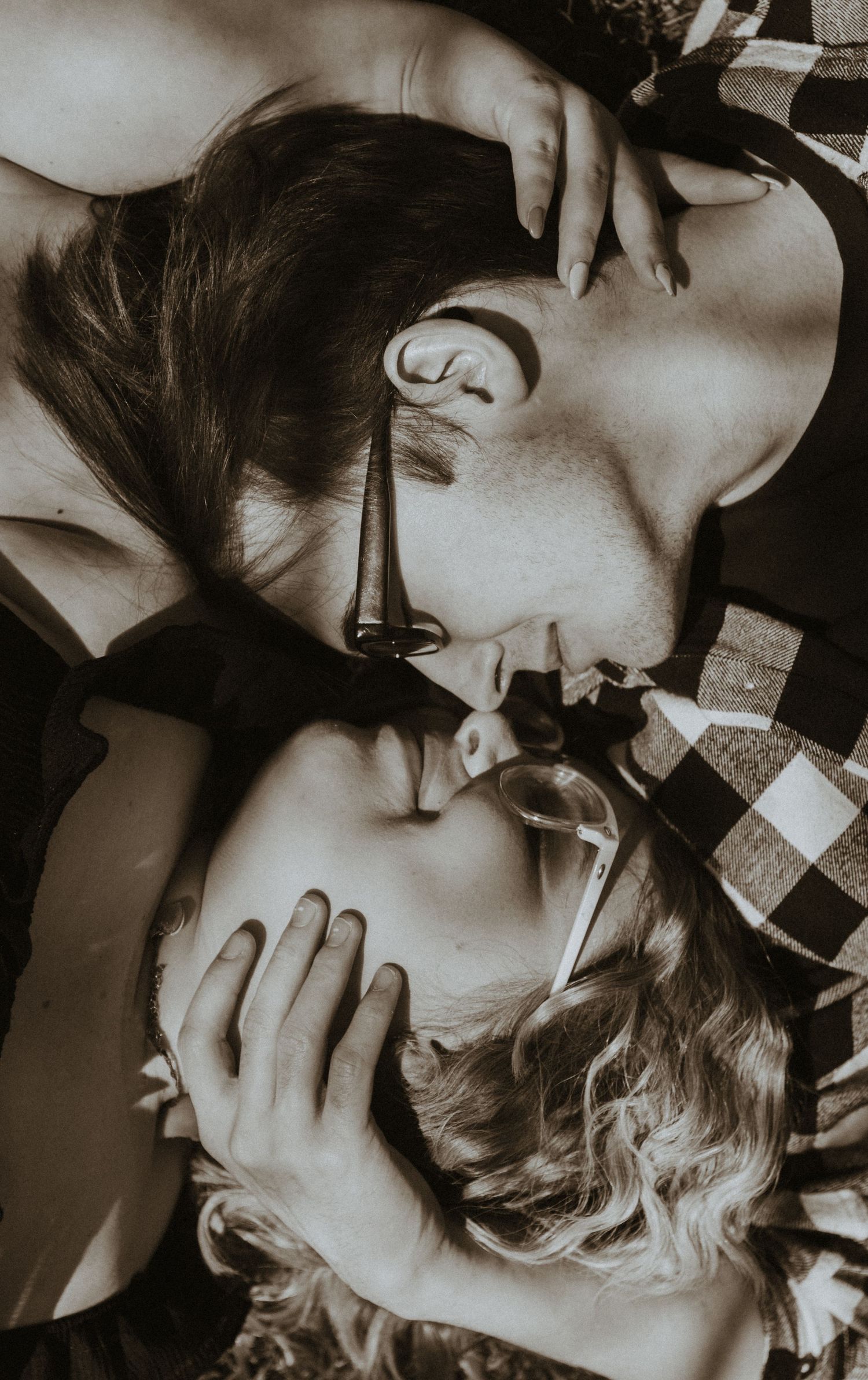 Couples nose to nose in black and white