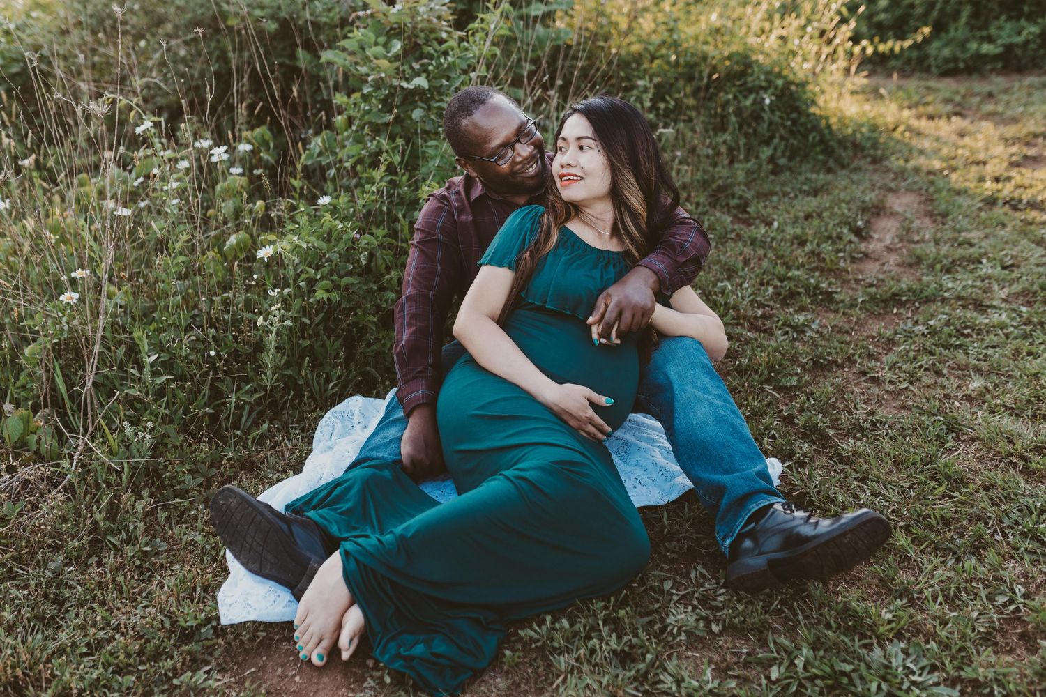 Pregnant woman is sitting with her husband outside in Lebanon, PA