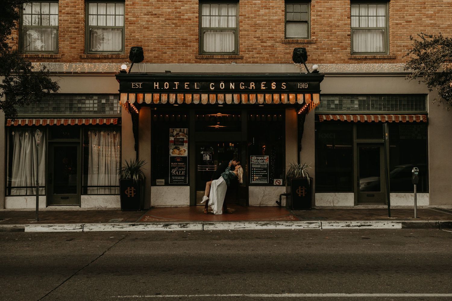 Historic brick building facade with vintage windows and storefronts.