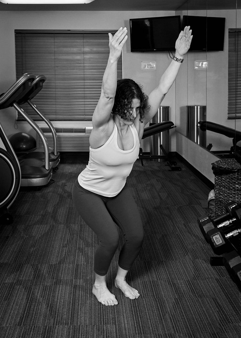 jenn pilotti demonstrating yoga position in tacoma holiday inn gym for her exercise and movement book