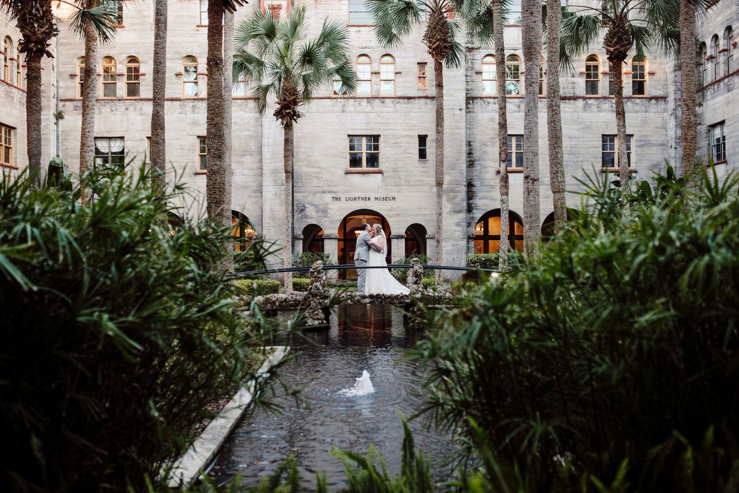 Bride and groom on the Lightner Museum front bridge.