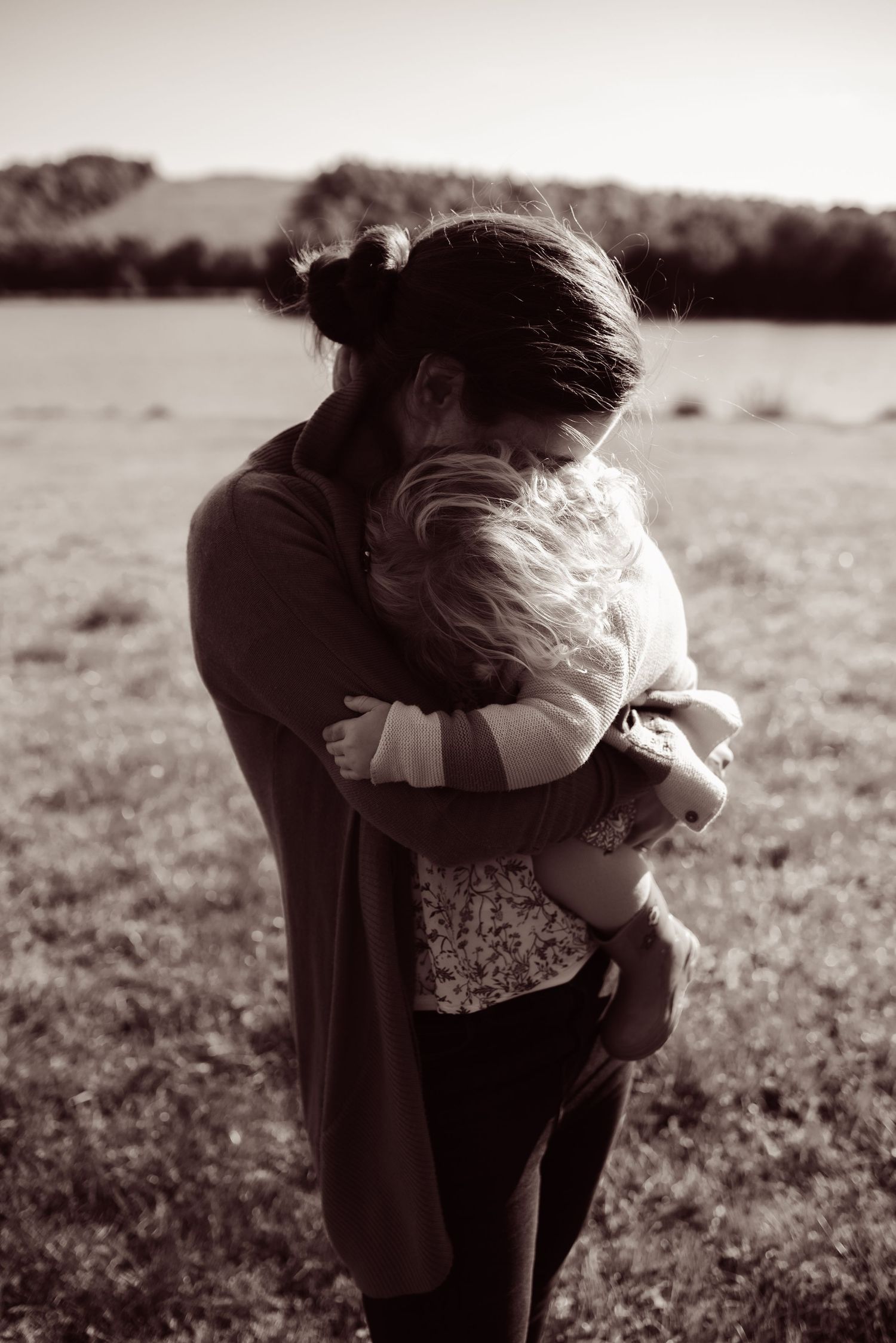 Black and white image of a mother and young daughter